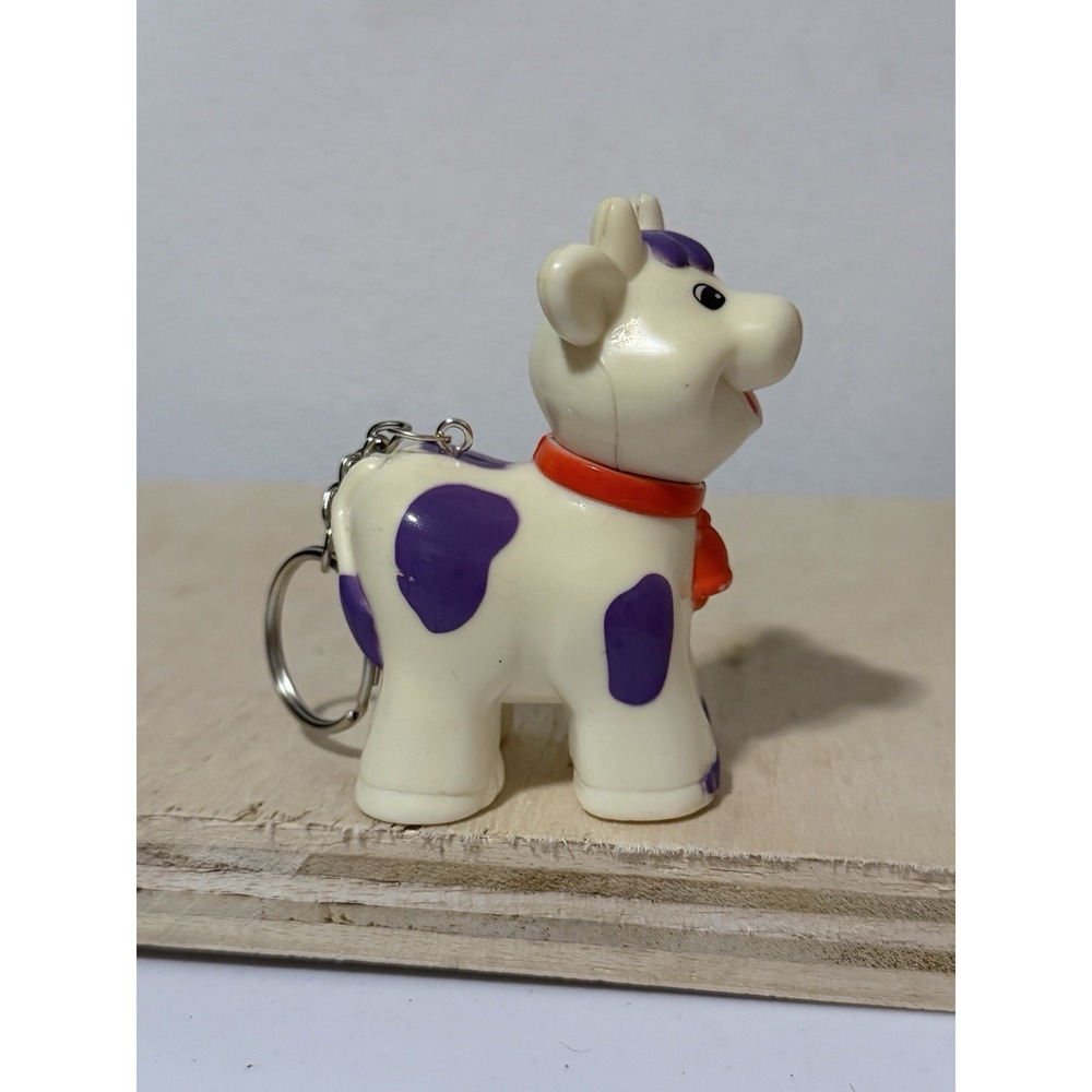 a Kiddieland Farm Animal Old McDonald Cow Upcycled Keychain